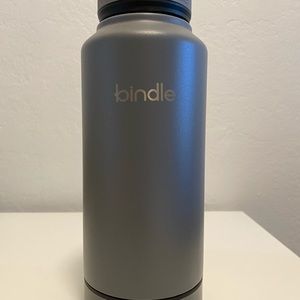 Bindle water bottle with storage compartment.